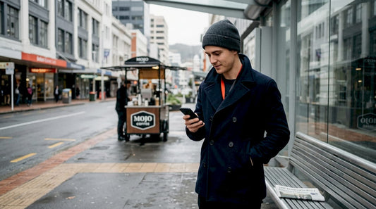 Man wearing beanie waiting bus Wellington