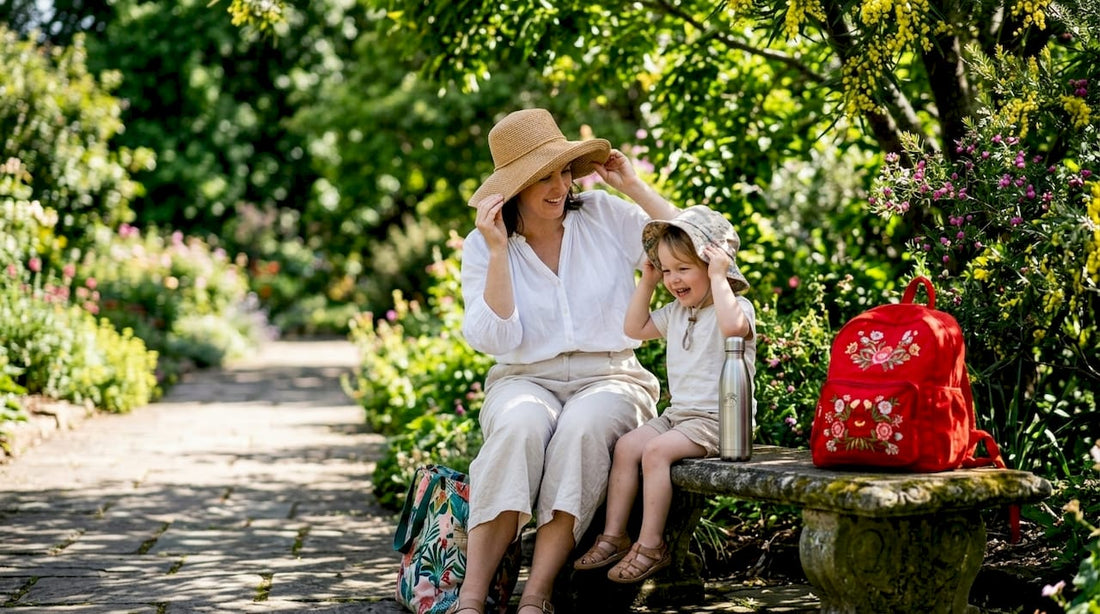 Woman and child adjusting sun hats in park