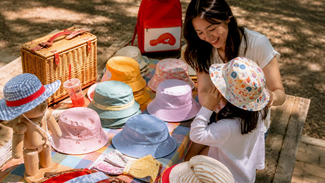 Outdoor market stall displaying kids sun hats