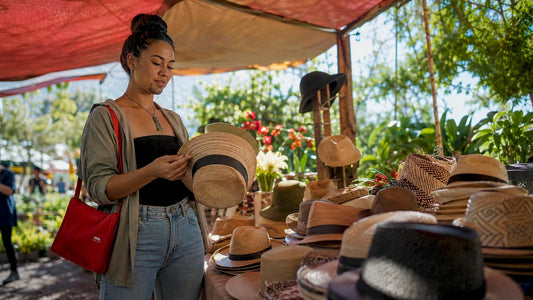 Woman shopping local Kiwi hats in boutique