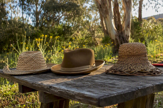 Traditional Australian heritage hats on fence post