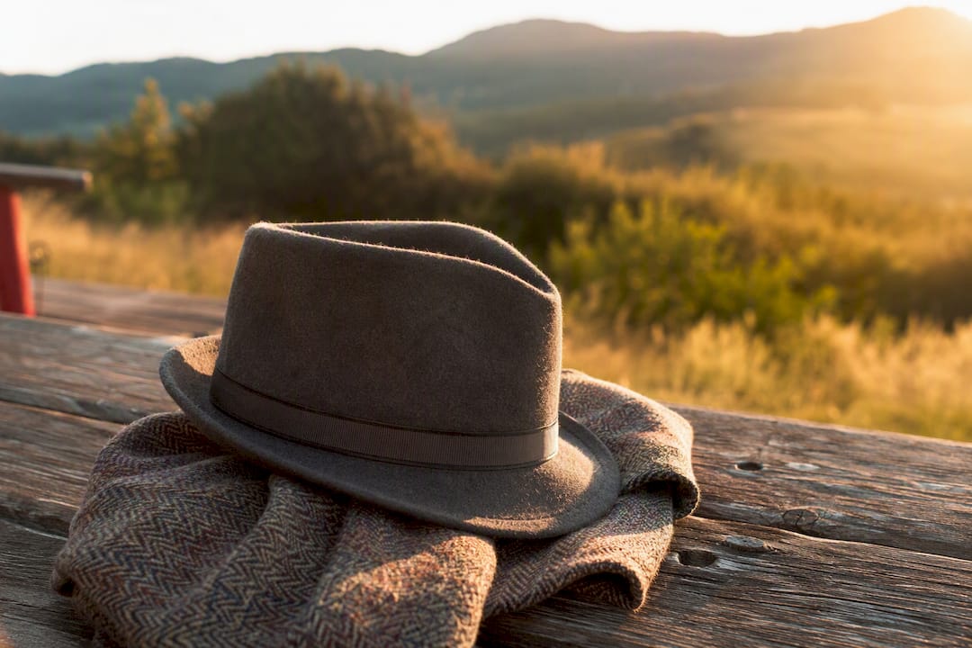 Wool trilby hat on wooden bench