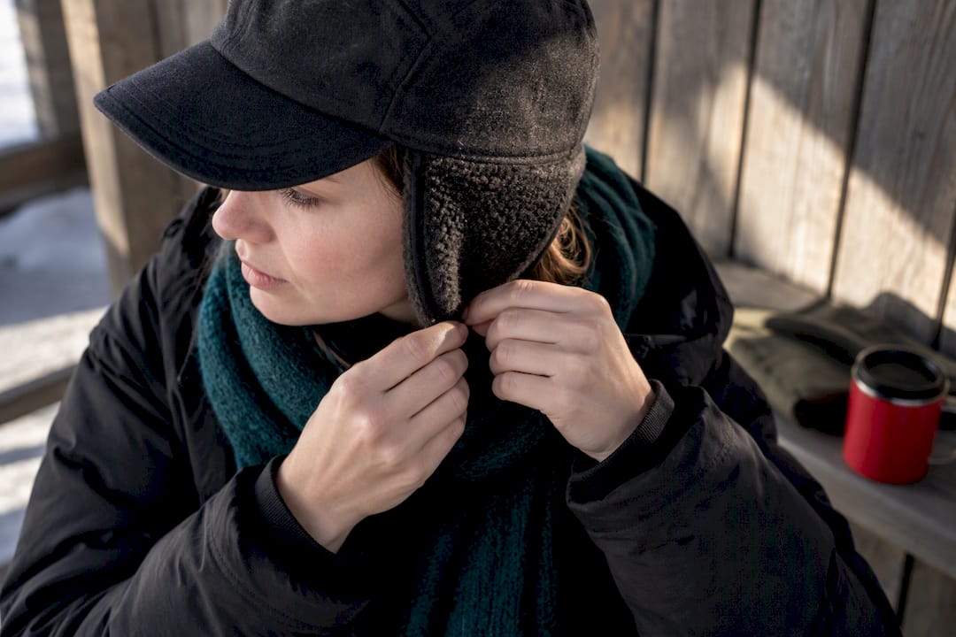 Close-up of earflap cap covering ear