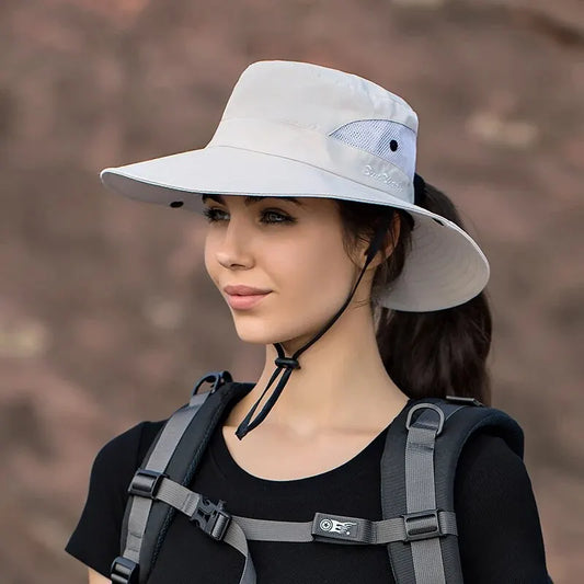 Foldable polyester sun hat in sky blue with a ponytail hole