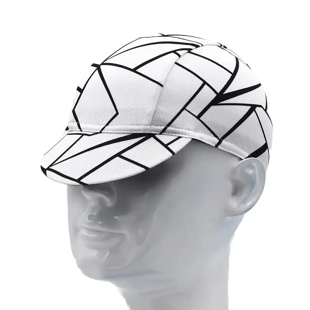 White cap with black geometric patterns on a mannequin head against a white background