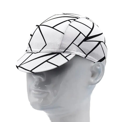White cap with black geometric patterns on a mannequin head against a white background