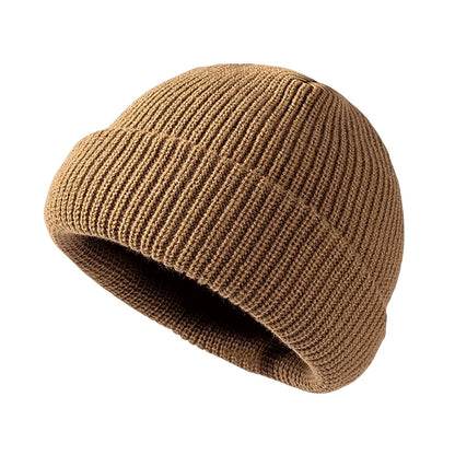 Brown knit beanie on a white background