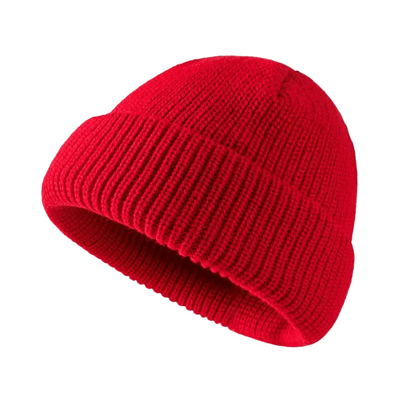 Red knit beanie on a white background