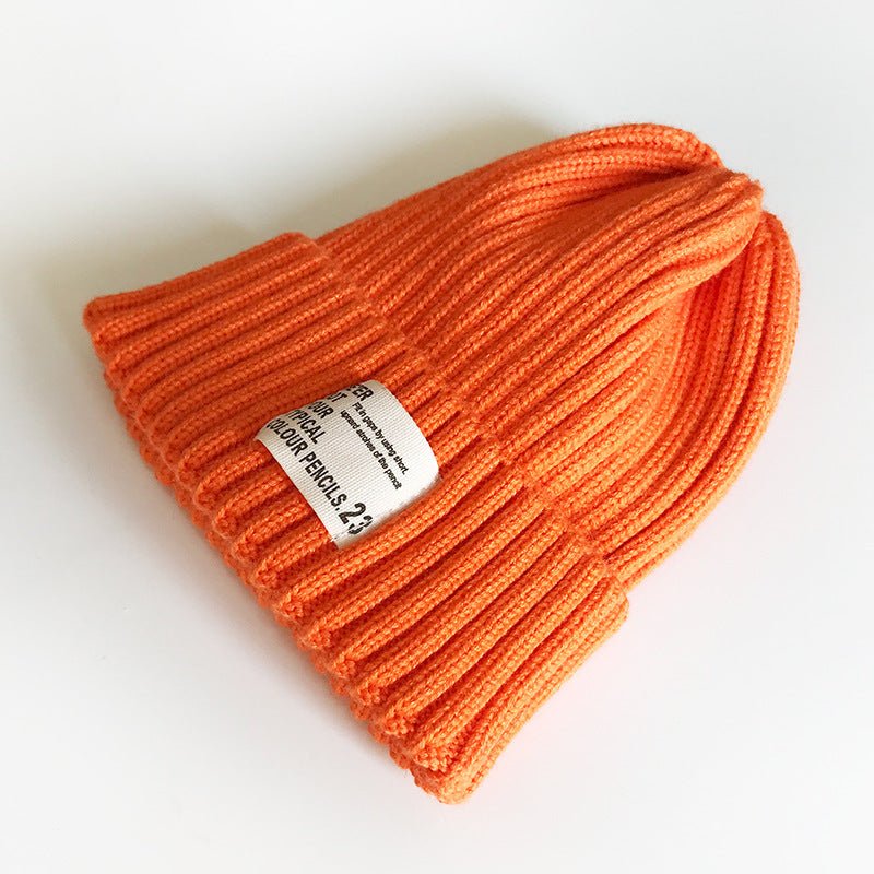 Street Style Label Beanie – Unisex Wool Knit Hat with Bold Tag Detail - Urban Caps